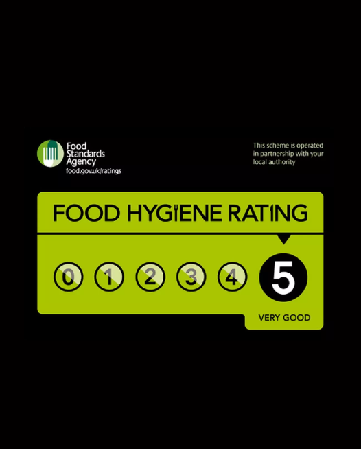 Two plates with onion bhajis on garnished with tomato and lettuce